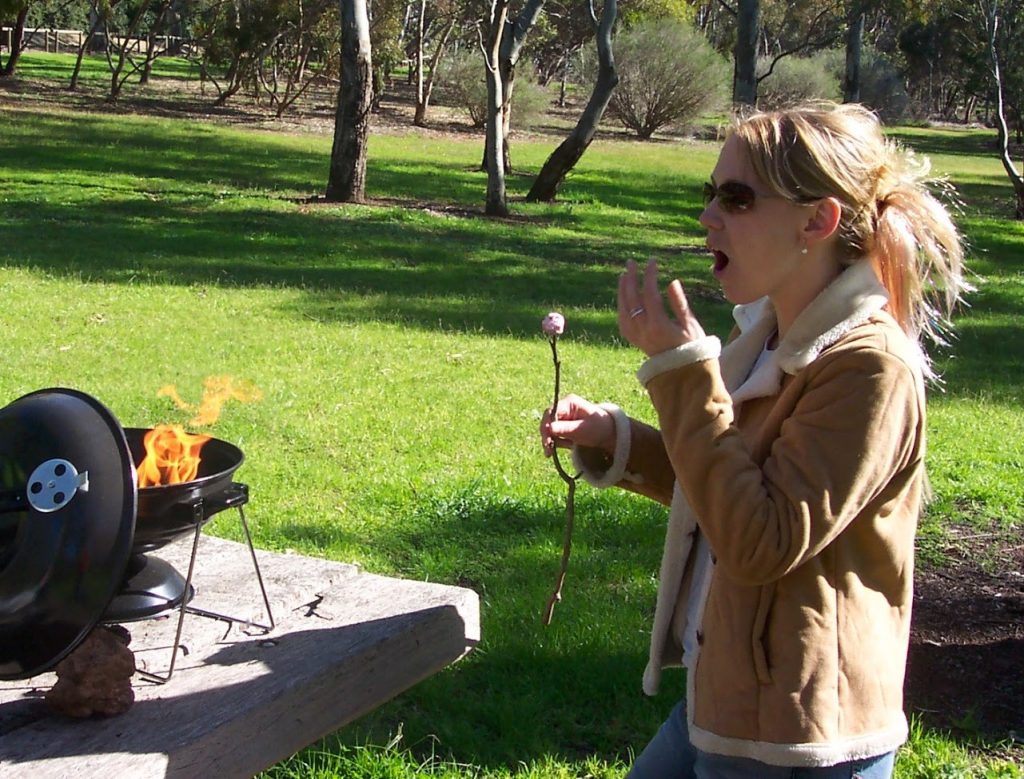 Hot chick eating a marshmallow with flames